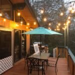 The upper patio at Lakeside on Lake Naomi with string lights