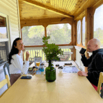 French Woods Festival parents enjoying breakfast on the screened-in porch at French Woods Farmhouse