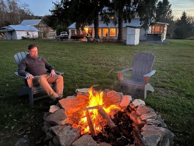 Andrew (a recent guest) enjoying the fire pit in the backyard