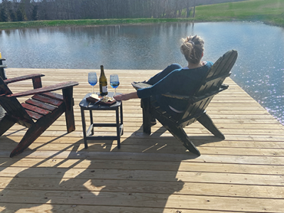 Enjoy a glass of wine on the sundeck overlooking the pond.